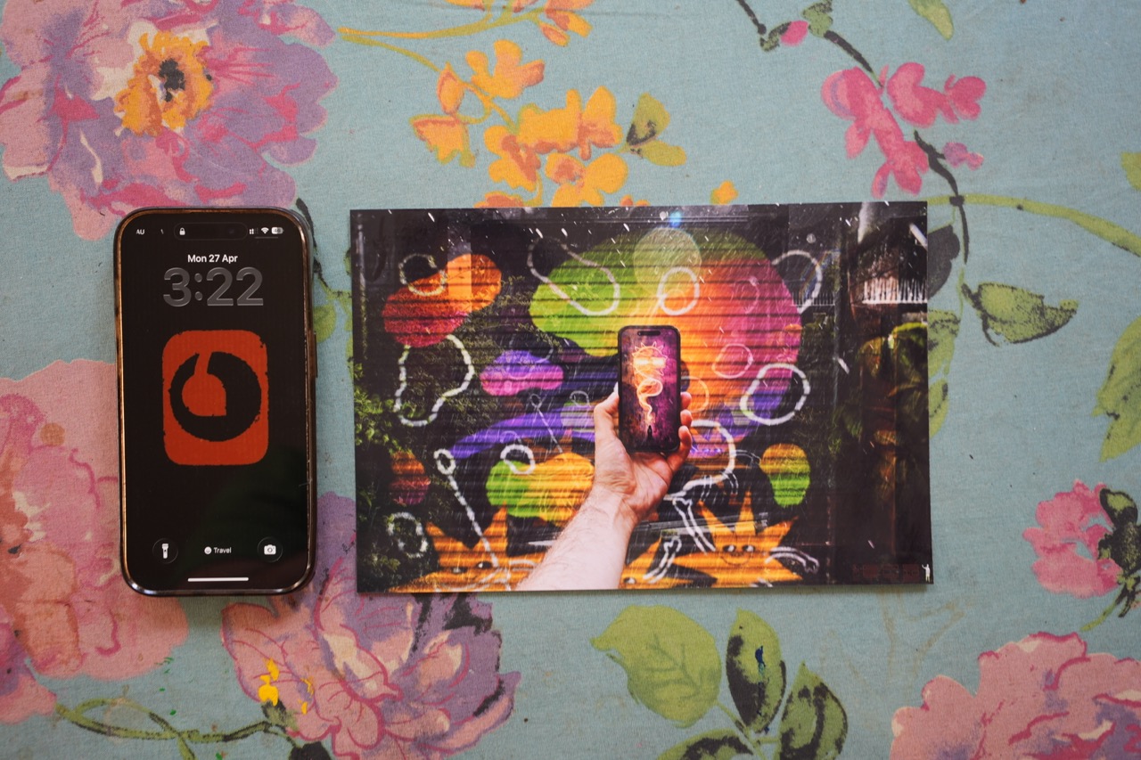 The documentary photograph: the physical print beside a live network clock